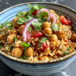 Vibrant Spicy Chickpea & Rice Bowl featuring chickpeas, rice, and veggies.