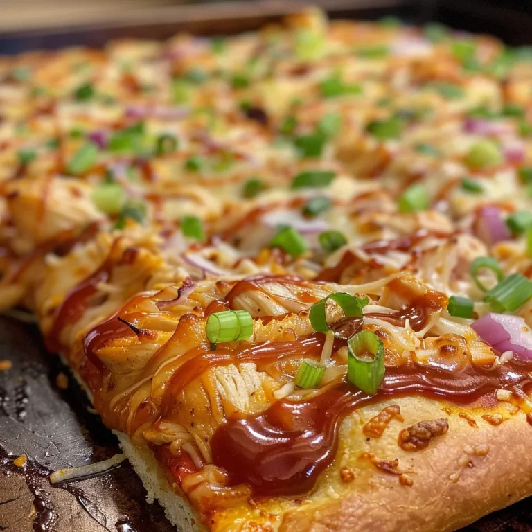 Juicy BBQ Chicken Pizza featuring a crispy crust and colorful garnishes.