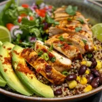 Close-up view of a Chicken and Quinoa Taco Bowl featuring colorful ingredients.