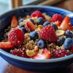 Close-up view of a Berry Quinoa Breakfast Bowl with colorful berries and quinoa.