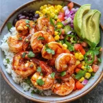 Close-up of a Fiesta Shrimp Rice Bowl with vibrant ingredients.