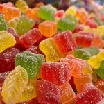Close-up of colorful fruit slices including strawberries and kiwi arranged on a plate.