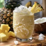 Close-up view of a colorful Ocean Love Colada in a glass, showcasing its creamy texture and tropical ingredients.