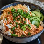 Close-up of a vibrant spicy tuna rice bowl, showcasing colorful ingredients.