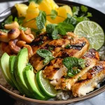 A close-up view of a vibrant Grilled Tropical Chicken Bowl filled with colorful ingredients.