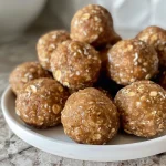 Close-up view of delicious vanilla protein balls arranged on a wooden surface.