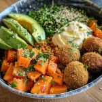 A vibrant Veggie couscous bowl with colorful ingredients, including butternut squash and avocado.