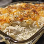 ['Close-up of a creamy cottage cheese chicken bake with melted mozzarella on top.', 'Side view of a hearty chicken bake featuring cottage cheese and seasonings.', 'A delicious dish of creamy chicken bake with a golden crust of mozzarella cheese.', 'Juicy chicken bake with a rich, creamy cottage cheese sauce and herbs.']