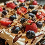 ['A close-up side view of colorful frozen yogurt bark with strawberries, blueberries, and granola.', 'Delicious frozen yogurt bark topped with fruits and chocolate chips, captured on an iPhone.', 'A vibrant piece of frozen yogurt bark showcasing layers of yogurt, fruits, and coconut flakes.', 'Close-up image of frozen yogurt bark featuring red strawberries and blue blueberries on a white background.']