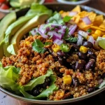 ['Close-up of a gluten-free loaded quinoa taco salad with vibrant ingredients.', 'Side view of a colorful quinoa taco salad featuring fresh vegetables and garnishes.', 'Juicy quinoa taco salad displayed with a variety of toppings and textures.', 'Detailed shot of a nutritious quinoa taco salad loaded with beans and avocado.']
