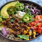 ['A vibrant Ground Beef Burrito Bowl featuring a mix of ingredients like rice, black beans, and fresh vegetables.', 'Close-up side view of a Ground Beef Burrito Bowl, showcasing juicy ground beef, avocado, and colorful toppings.', 'An appetizing Ground Beef Burrito Bowl filled with rice, ground beef, corn, and garnished with cilantro and lime.', 'A detailed shot of a Ground Beef Burrito Bowl with layers of ingredients, including cheese, lettuce, and tomatoes.']