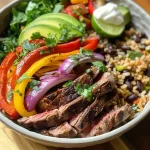['Close-up of a vibrant steak fajita bowl with colorful peppers and avocado.', 'Side view of a delicious high protein steak fajita bowl filled with steak, rice, and toppings.', 'Juicy steak fajita bowl displayed with sliced avocado and fresh cilantro.', 'Colorful ingredients in a steak fajita bowl, showcasing bell peppers and Greek yogurt.']
