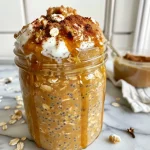 ['Close-up view of a bowl of Pumpkin Pie Overnight Oats topped with chia seeds.', 'Side view of creamy pumpkin pie overnight oats with a sprinkle of chia seeds.', 'Detailed look at pumpkin pie overnight oats in a glass jar, showcasing ingredients.', 'Enticing close-up of overnight oats with pumpkin puree and chia seeds in a bowl.']
