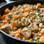 ['Close-up view of a delicious chicken and brown rice casserole with colorful sweet potatoes and spinach.', 'Side view of a high-protein chicken casserole, highlighting juicy chicken pieces and a creamy texture.', 'Detailed shot of a savory chicken and rice casserole, showcasing vibrant ingredients like spinach and miso.', 'Appetizing presentation of a chicken and brown rice dish with a golden crust and fresh vegetables.']
