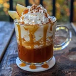 ['A glass of caramel apple cider with a smooth surface and caramel drizzle on top.', 'Close-up side view of a refreshing caramel apple cider drink garnished with caramel.', 'A warm cup of caramel apple cider showcasing its rich amber color and cinnamon sprinkle.', 'A detailed shot of caramel apple cider in a glass, highlighting the caramel topping and inviting texture.']