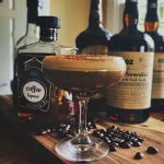 ['Close-up view of a Maple Bourbon Espresso Martini in a stylish glass with a frothy top.', 'Side angle of a Maple Bourbon Espresso Martini featuring rich colors and a creamy foam.', 'Artistic shot of a Maple Bourbon Espresso Martini showcasing its glossy finish and garnishes.', 'Detailed side view of a Maple Bourbon Espresso Martini with espresso and maple syrup highlights.']