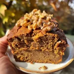 Close-up view of moist high protein pumpkin bread with texture visible.